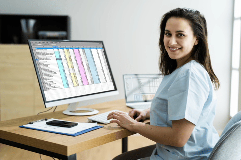 Woman working with spreadsheets on her computer